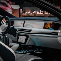 Explore the sleek and modern design of a luxury car interior, showcasing advanced technology and premium materials.