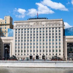 Facade of the Russian Ministry building in Moscow along the river under a clear sky.