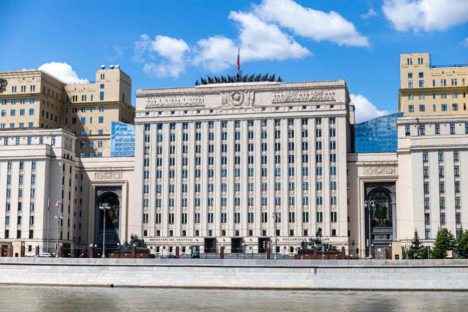 Facade of the Russian Ministry building in Moscow along the river under a clear sky.
