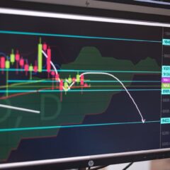 Close-up of a cryptocurrency trading chart displayed on a monitor, showing market trends and analysis.