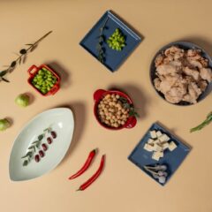 Top view of vegan ingredients including tofu, chickpeas, and spices for a healthy meal.