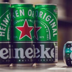 Close-up of Heineken beer cans emphasizing brand and design.