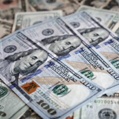 Close-up of various US dollar bills highlighting finance and economy.