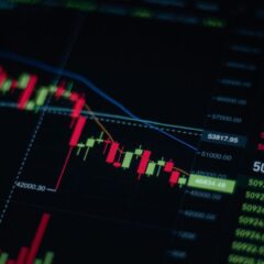 Close-up of stock market chart showing trends and data on a digital screen.