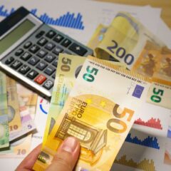 Euro and Romanian Lei currency with calculator on a financial desk setup.