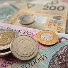 Close-up of Polish coins and banknotes, showcasing zloty currency details.