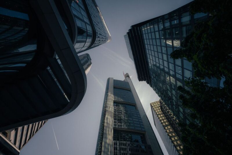 Upward view of modern skyscrapers in Frankfurt, capturing the city's impressive architecture.
