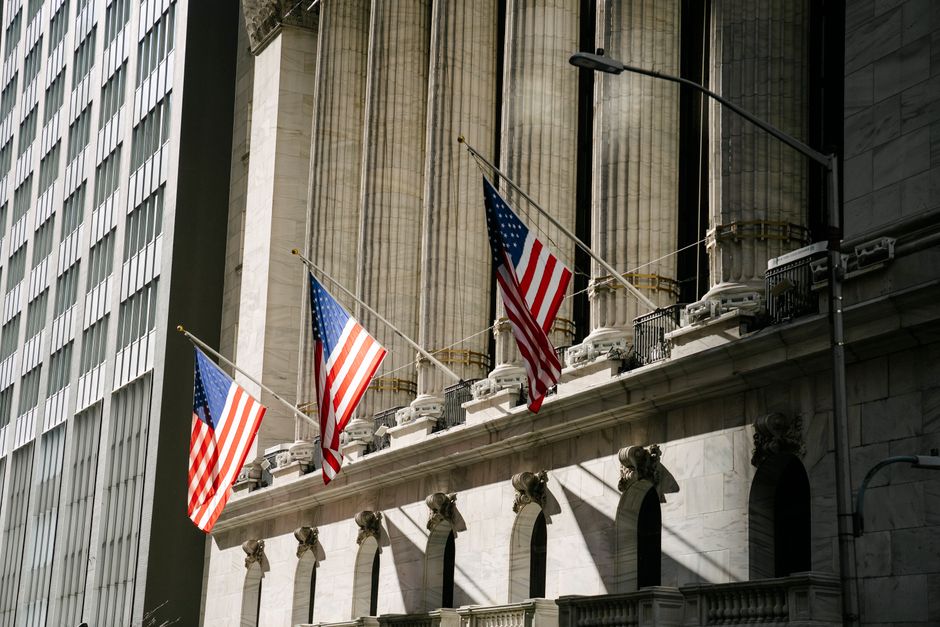 Grand architectural building adorned with American flags, symbolizing patriotism and history.