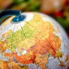 Vibrant close-up of a globe displaying the Eurasian continent, featuring countries like China and Russia.