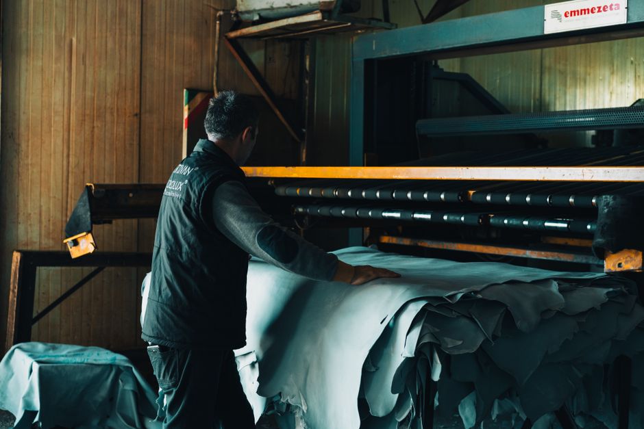 Leathercraft worker processing hides in Gerede tannery, Türkiye.