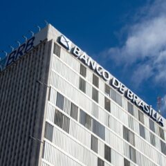 A prominent view of Banco de Brasília building with clear blue sky background in Brasilia.