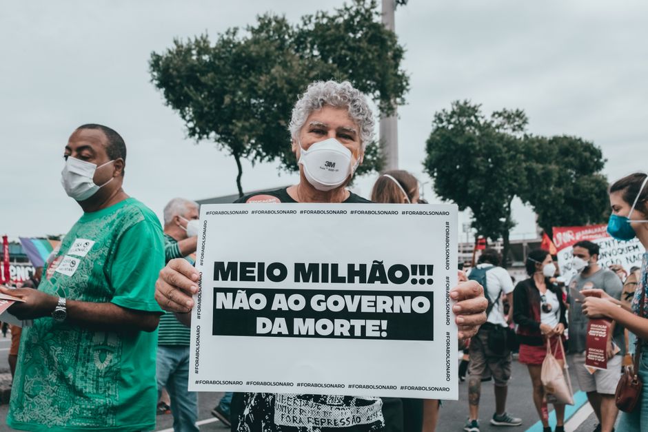Large group of people in Rio de Janeiro protesting against government policies during a day event.