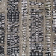 High-angle aerial shot of a massive car parking area, filled with vehicles in Brazil.
