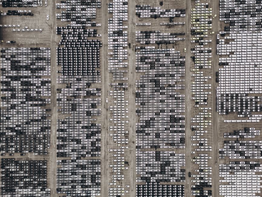 High-angle aerial shot of a massive car parking area, filled with vehicles in Brazil.